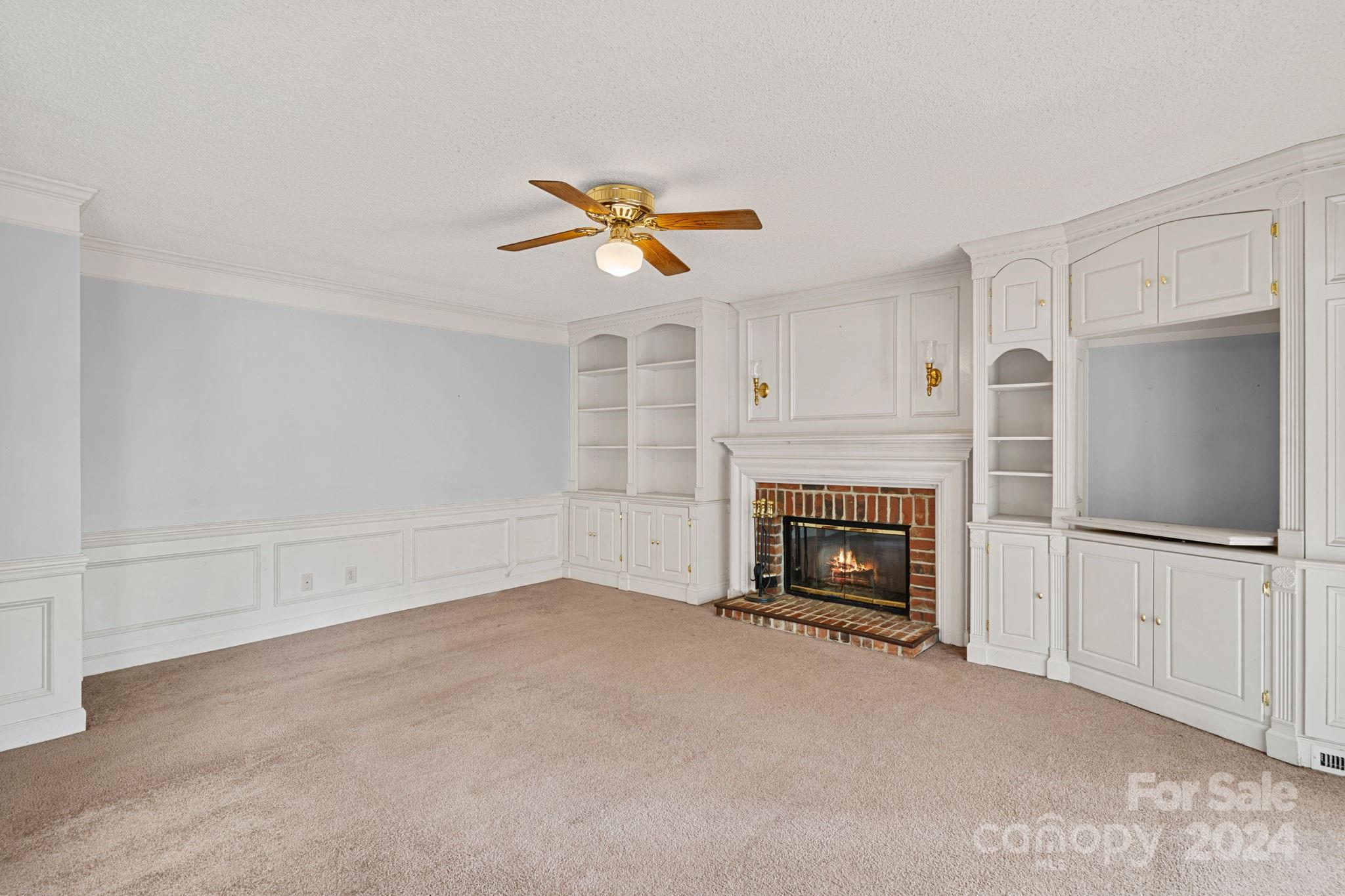 12516 Hawks Ridge Road Huntersville, NC 28078 - Photo 10 of 36 a view of a livingroom with a fireplace and window