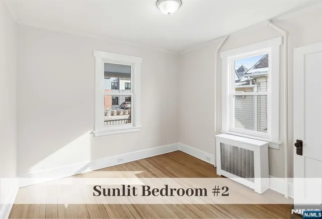 a view of a bedroom & window