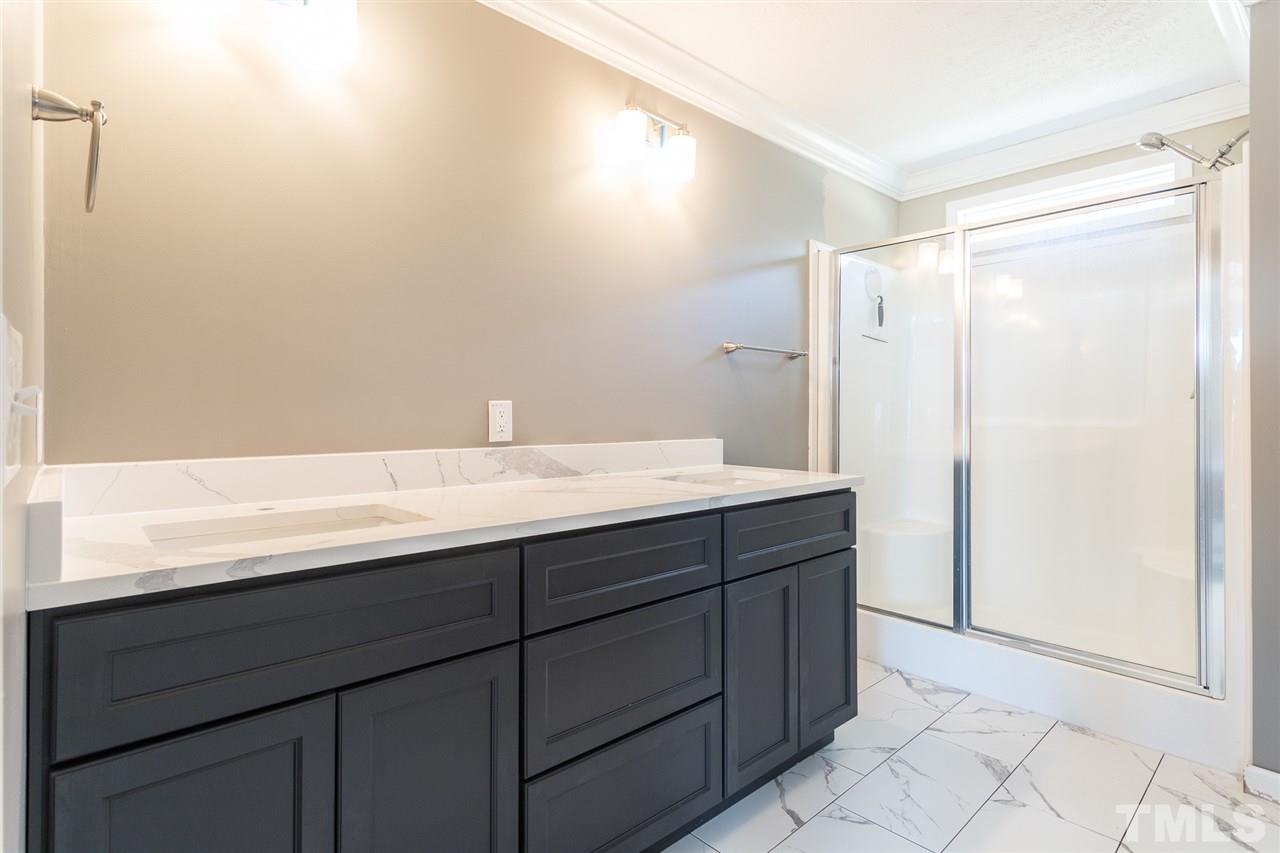 3374 Prophecy Road Middlesex, NC 27557 - Photo 14 of 21 New vanity! Heated floors! New storage shelves!