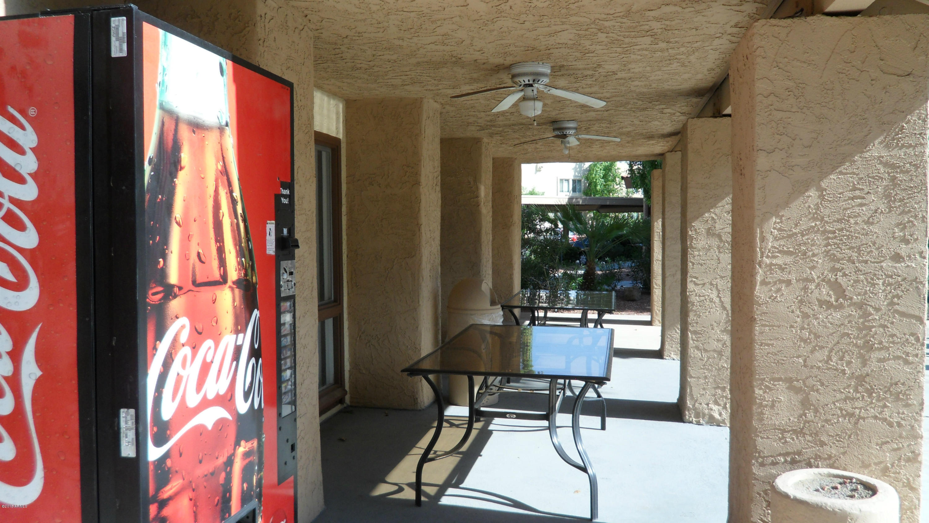 2121 West Royal Palm Road, Unit 2099 Phoenix, AZ 85021 - Photo 10 of 11 Covered patio across from pool area