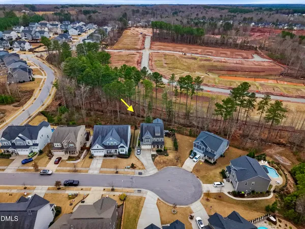an aerial view of a house with outdoor space