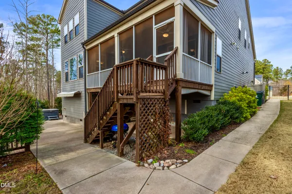 a view of a deck with furniture and umbrella