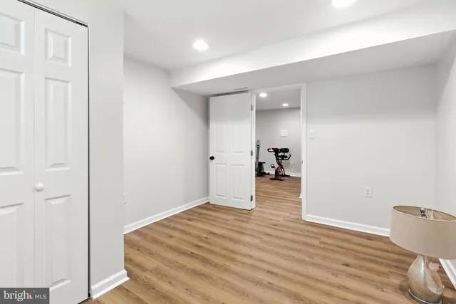 a view of a room with wooden floor