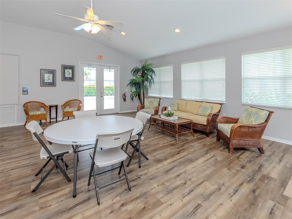 205 Reclinata Circle Venice, FL 34292 - Photo 37 of 62 a view of a dining room with furniture window and wooden floor