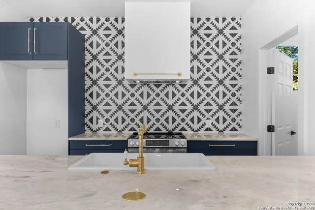 a bathroom with a sink and mirror