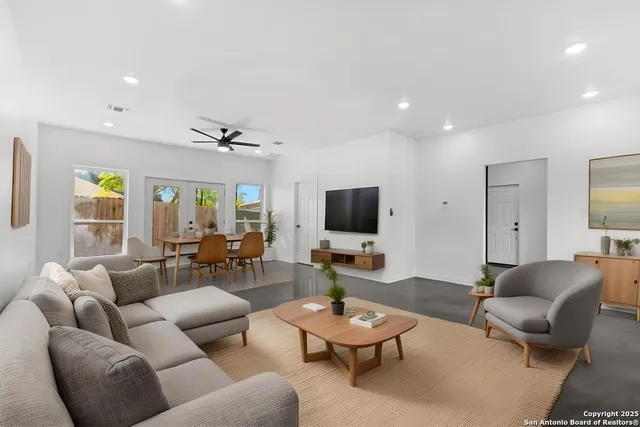 a living room with furniture and a flat screen tv