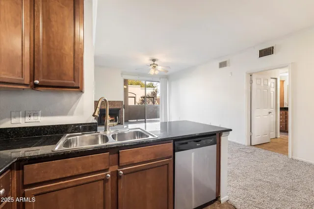 a kitchen with a sink and cabinets