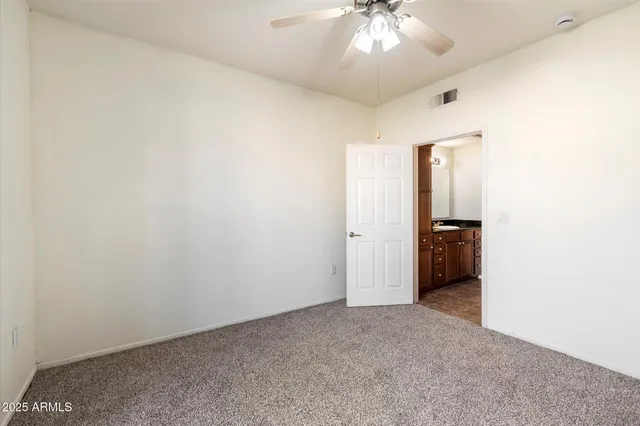 an empty room with a bathroom