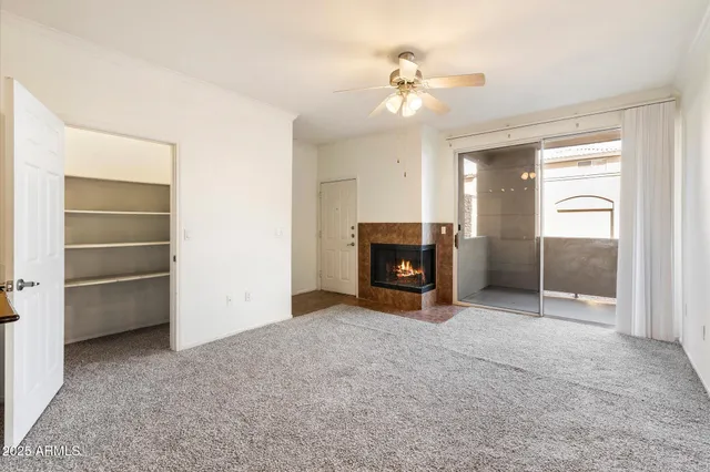a view of empty room with a fireplace