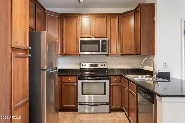 a kitchen with a stove microwave and refrigerator