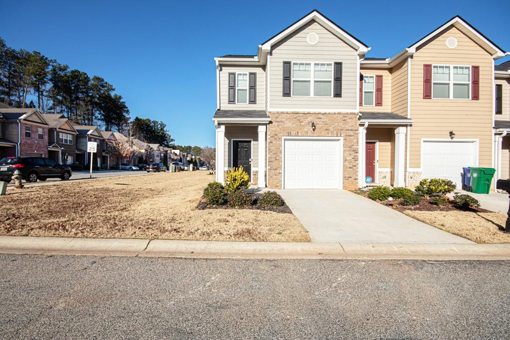 4040 Kingsbrook Boulevard Decatur, GA 30034 - Photo 1 of 1 a front view of a house with a yard