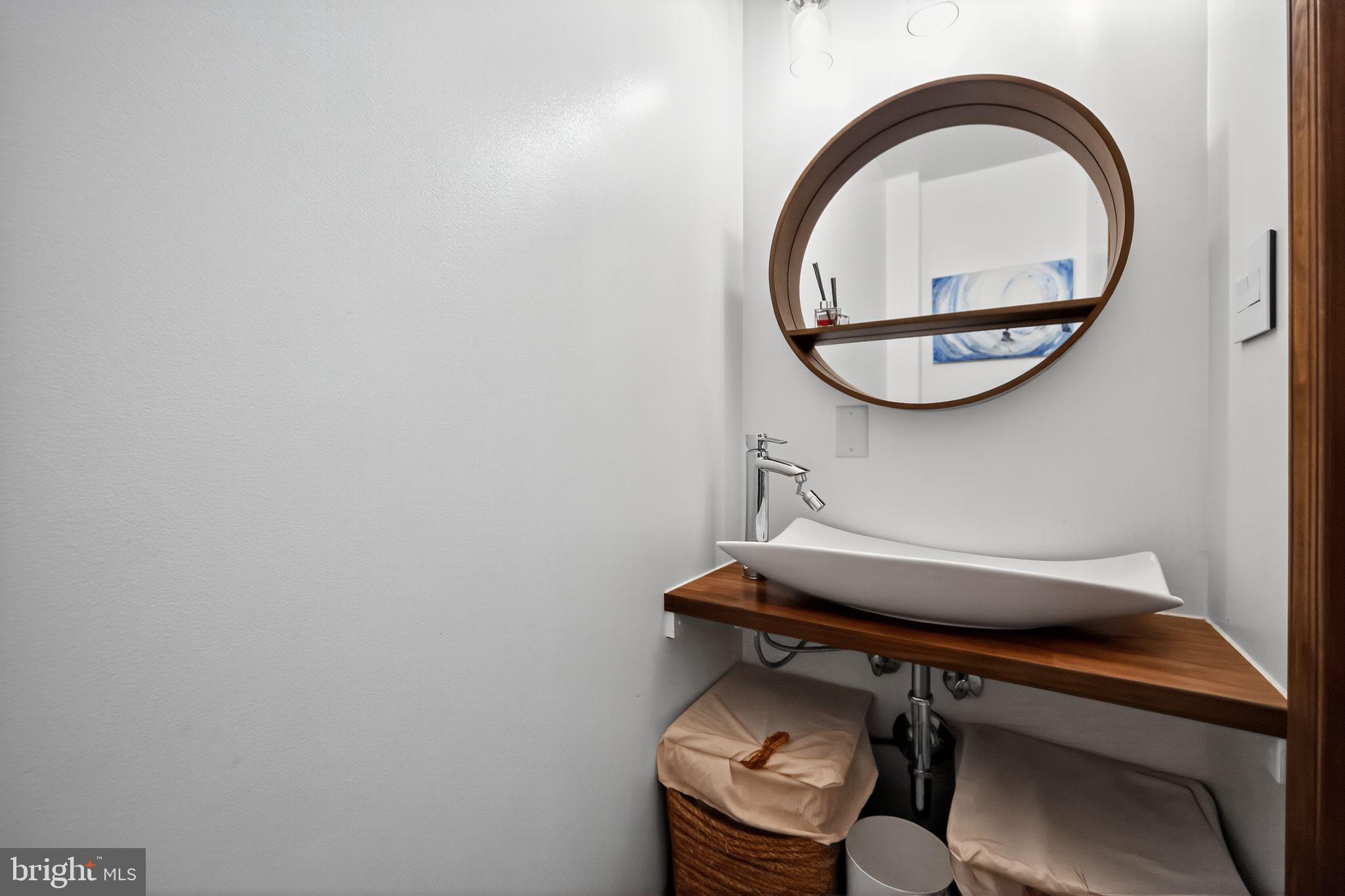 575 West Valley Road Wayne, PA 19087 - Photo 13 of 36 a view of a room with a table and a mirror