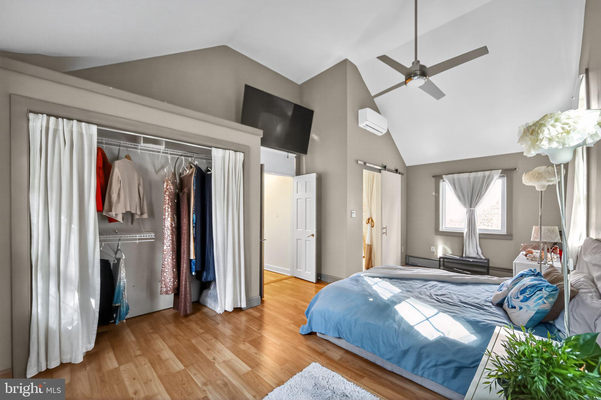 575 West Valley Road Wayne, PA 19087 - Photo 14 of 36 a bedroom with a bed ceiling fan and a window