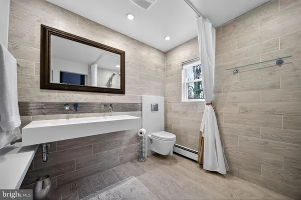 a view of a room with gym equipment and a window