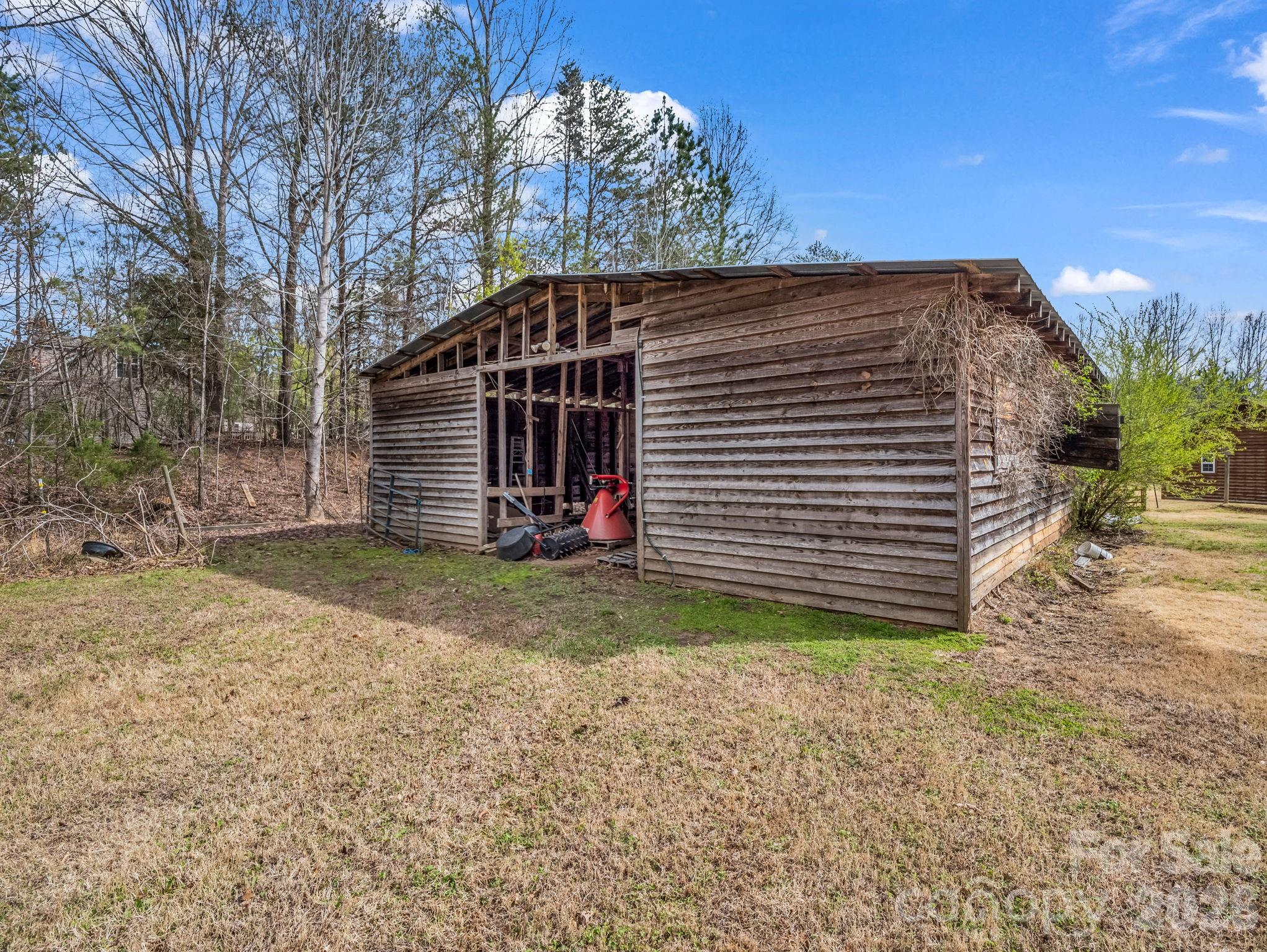 308 Frog Hollow Road Rutherfordton, NC 28139 - Photo 8 of 26 a view of a house with a yard and garage