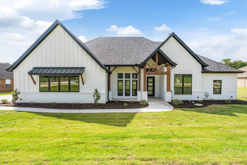 a view of a house with pool and yard