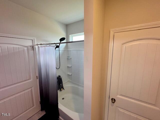 140 Continental Lane Smithfield, NC 27577 - Photo 17 of 28 a bathroom with a shower and a tub