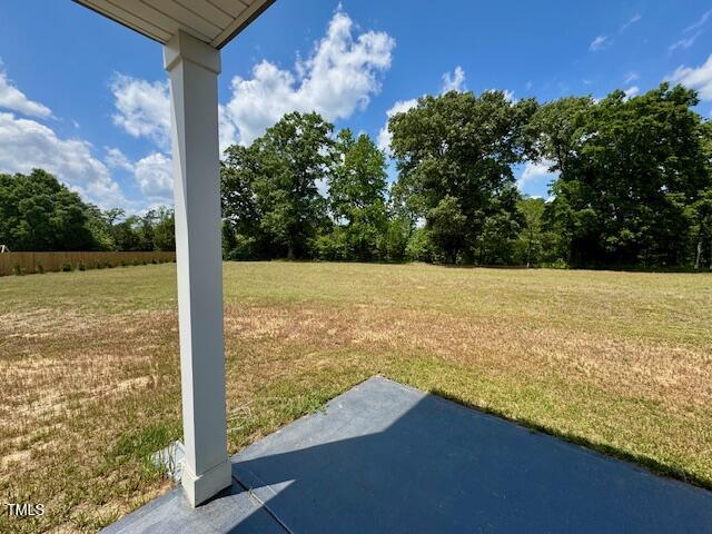 140 Continental Lane Smithfield, NC 27577 - Photo 23 of 28 a view of a room with floor to ceiling windows and a yard