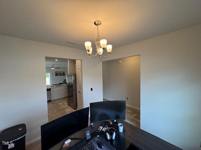 140 Continental Lane Smithfield, NC 27577 - Photo 5 of 28 a workspace with furniture and chandelier