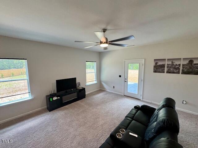 140 Continental Lane Smithfield, NC 27577 - Photo 9 of 28 a living room with furniture and a flat screen tv