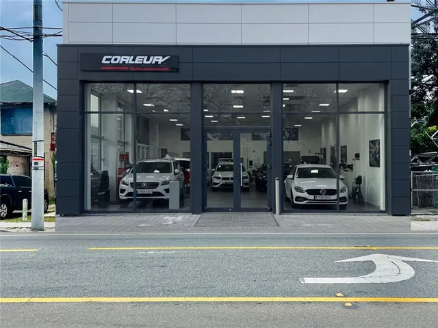 a view of a building with car parked