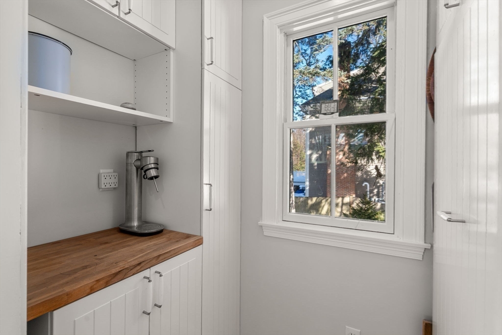 103 Oak Street Reading, MA 01867 - Photo 11 of 35 a view of kitchen with wooden floor and window