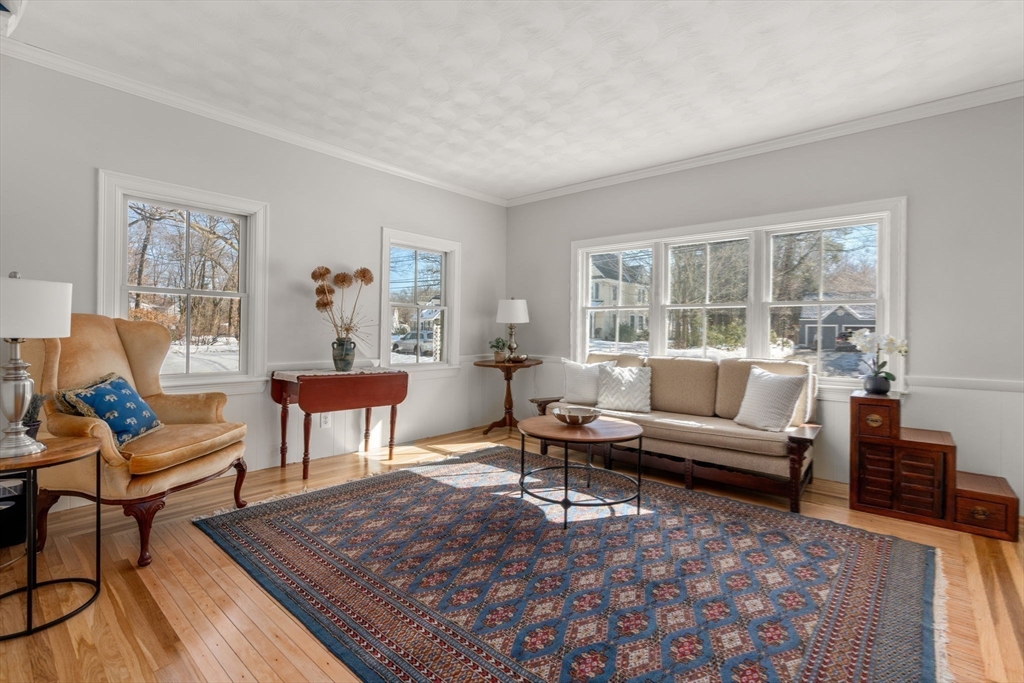 103 Oak Street Reading, MA 01867 - Photo 13 of 35 a living room with furniture a rug a lamp and a window