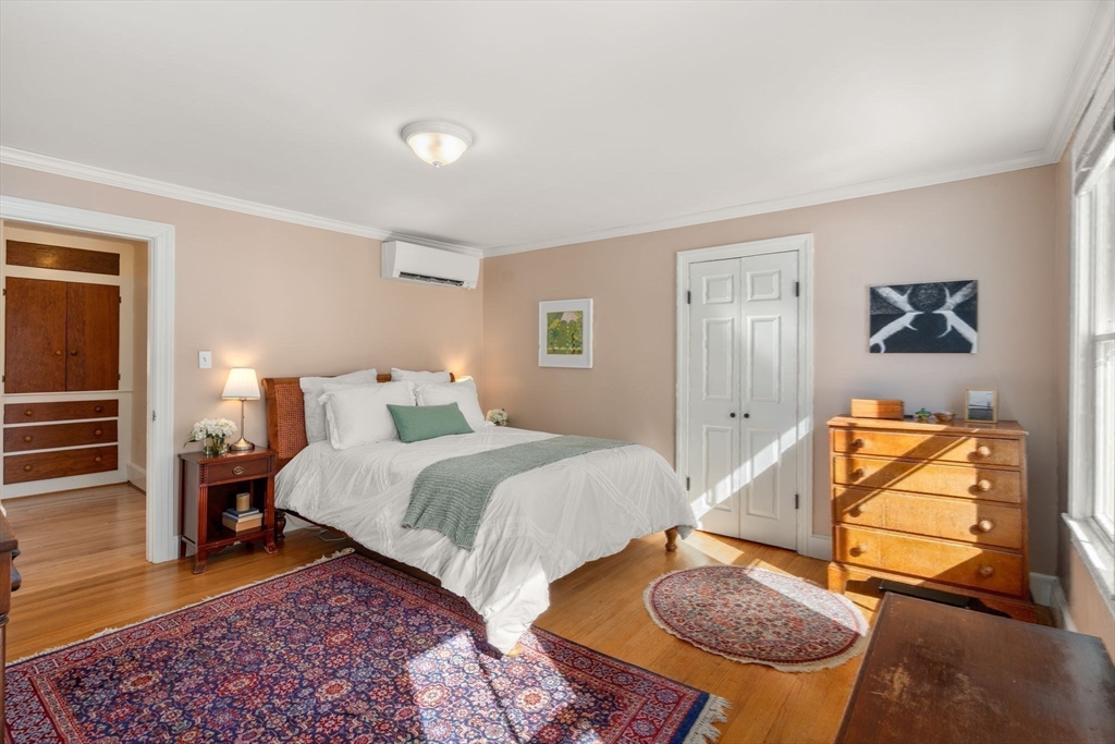 103 Oak Street Reading, MA 01867 - Photo 17 of 35 a bedroom with bed and a couch