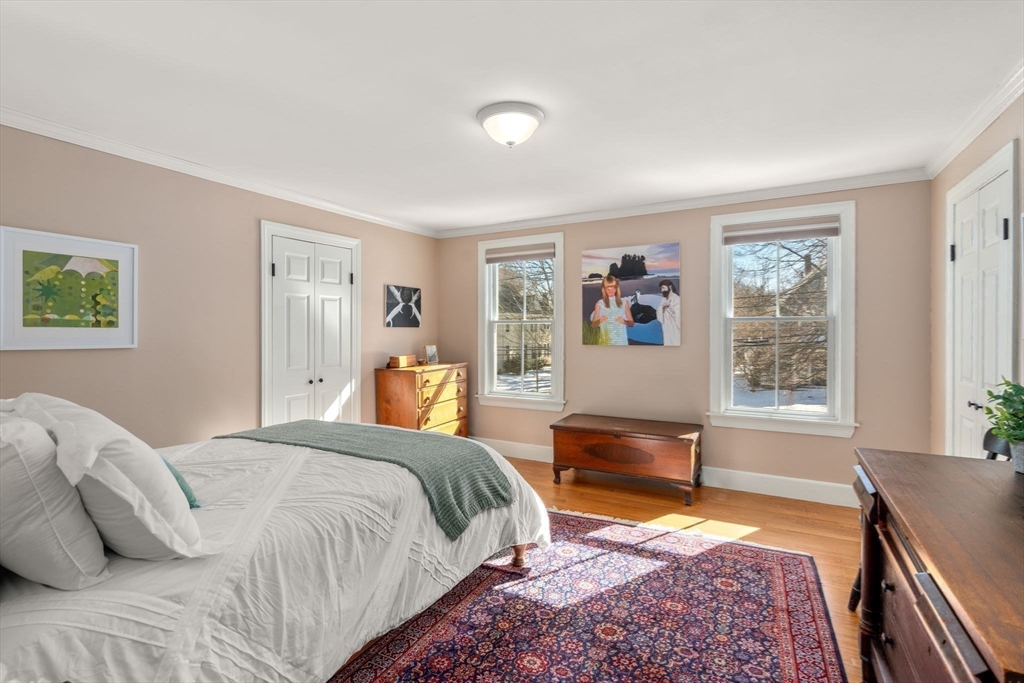 103 Oak Street Reading, MA 01867 - Photo 18 of 35 a bedroom with a large bed and a window