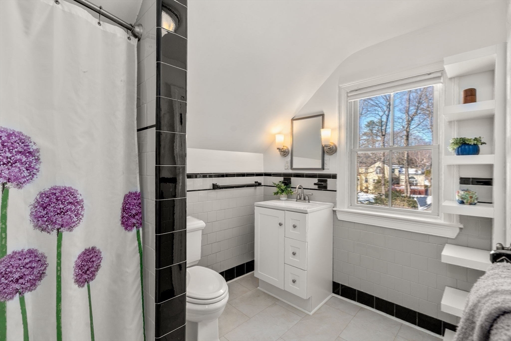 103 Oak Street Reading, MA 01867 - Photo 19 of 35 a bathroom with a sink mirror vanity and toilet