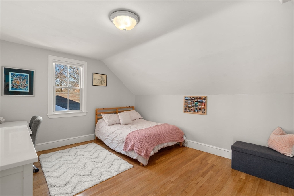 103 Oak Street Reading, MA 01867 - Photo 20 of 35 a bedroom with a bed and furniture