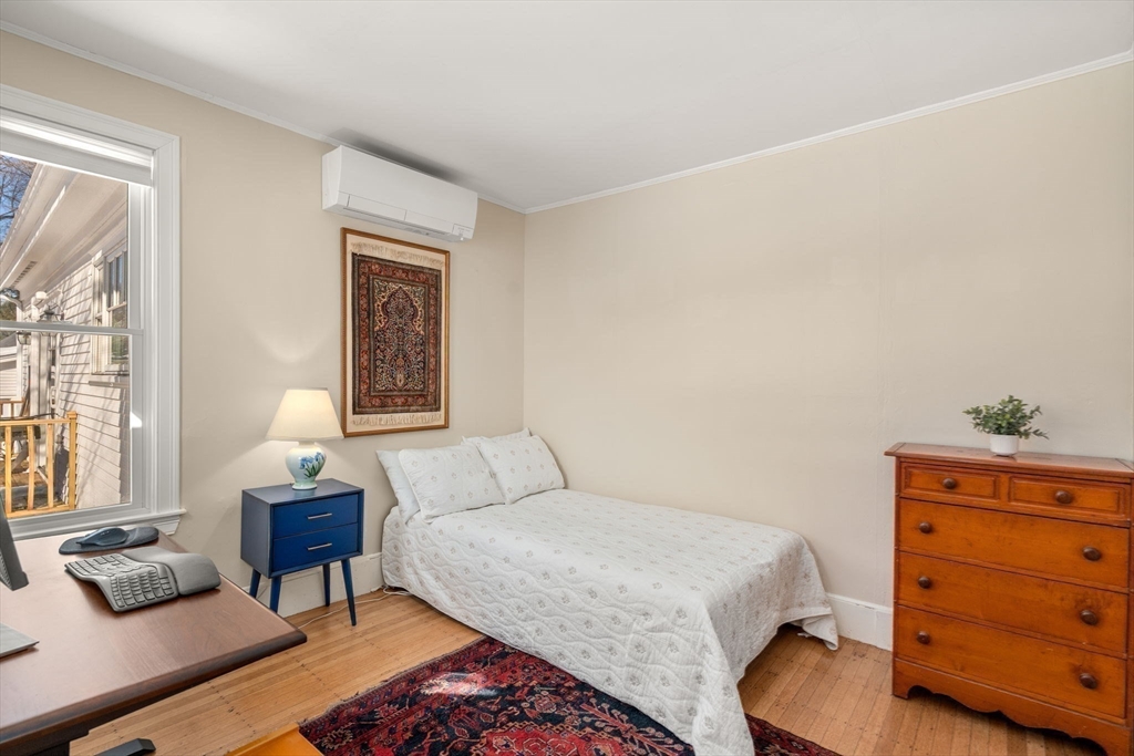 103 Oak Street Reading, MA 01867 - Photo 21 of 35 a bedroom with a bed and window