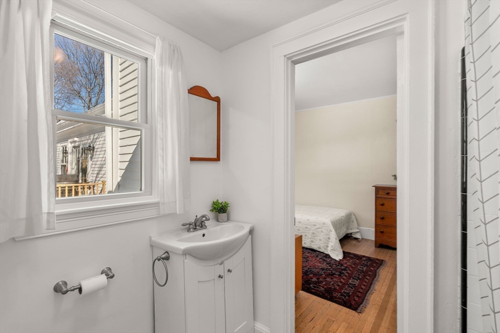 103 Oak Street Reading, MA 01867 - Photo 22 of 35 a bathroom with a sink toilet and shower