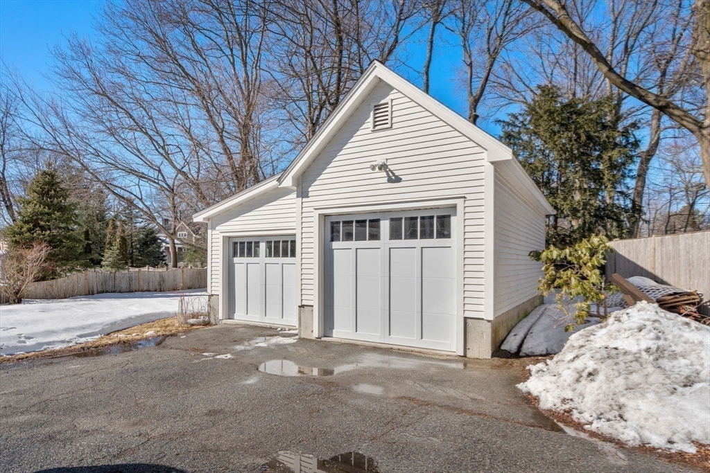 103 Oak Street Reading, MA 01867 - Photo 25 of 35 a view of a house with a snow in the yard