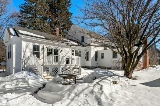 103 Oak Street Reading, MA 01867 - Photo 26 of 35 a view of a house with a snow in the yard