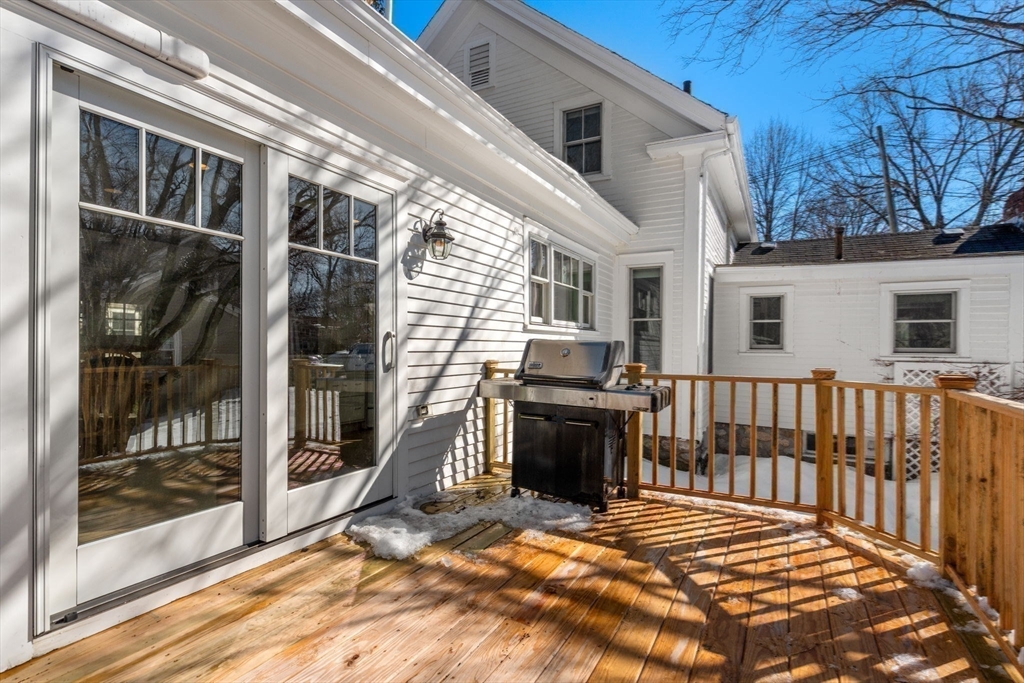 103 Oak Street Reading, MA 01867 - Photo 27 of 35 a view of backyard with barbeque grill and outdoor seating