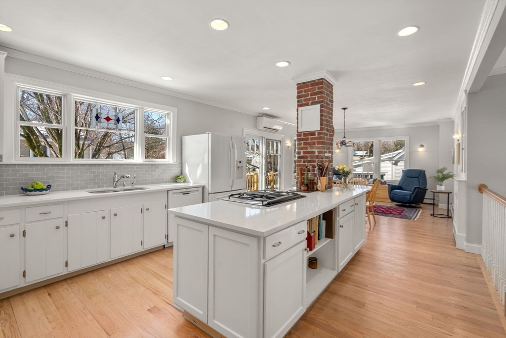 103 Oak Street Reading, MA 01867 - Photo 6 of 35 a kitchen with sink stove and wooden floor