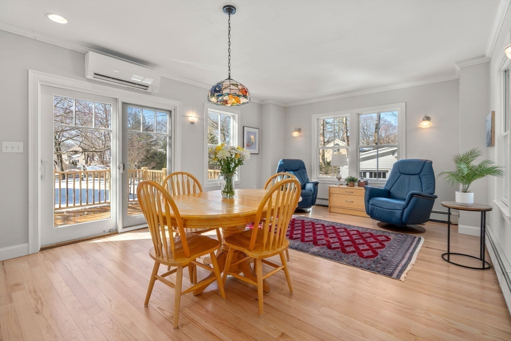 103 Oak Street Reading, MA 01867 - Photo 10 of 35 a view of a dining room with furniture wooden floor and chandelier
