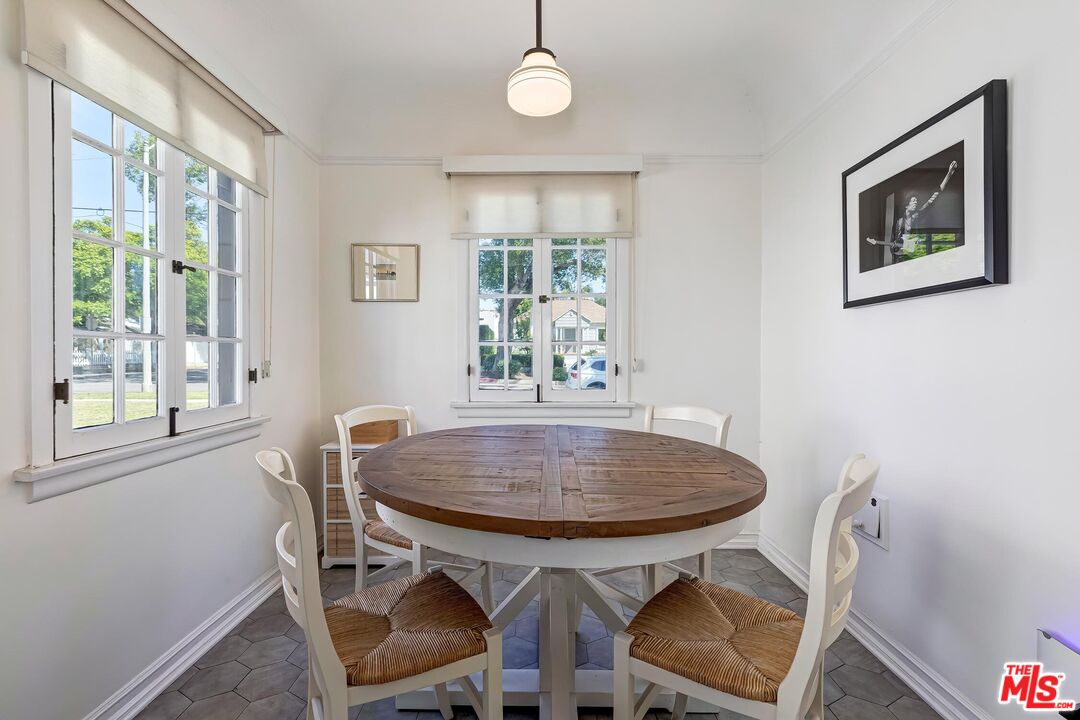3720 Valleybrink Road Los Angeles, CA 90039 - Photo 15 of 31 a view of a dining room with furniture window and wooden floor