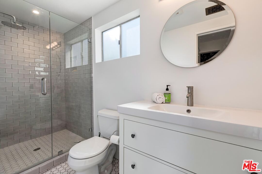3720 Valleybrink Road Los Angeles, CA 90039 - Photo 19 of 31 a bathroom with a sink a toilet and shower