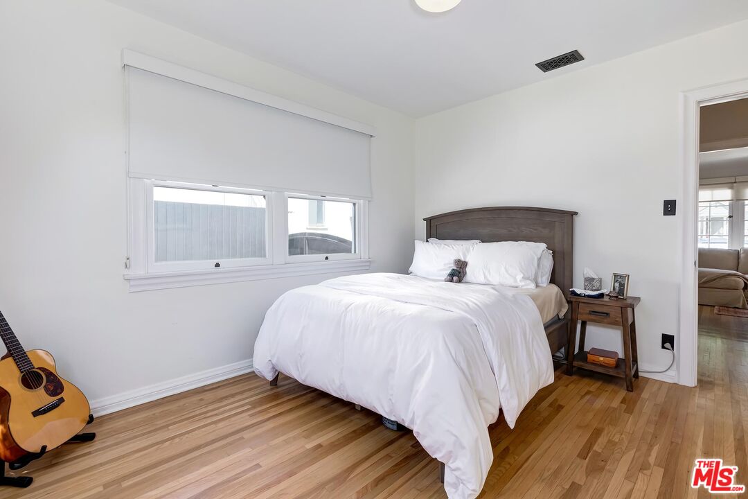 3720 Valleybrink Road Los Angeles, CA 90039 - Photo 21 of 31 a bedroom with a bed and window