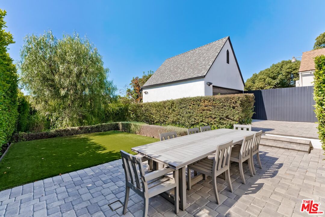 3720 Valleybrink Road Los Angeles, CA 90039 - Photo 26 of 31 a view of a patio with table and chairs with wooden floor and fence