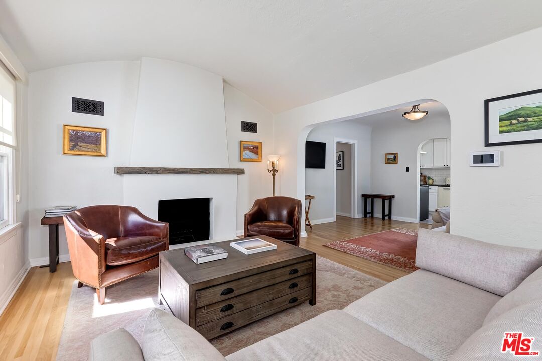 3720 Valleybrink Road Los Angeles, CA 90039 - Photo 5 of 31 a living room with furniture fireplace and rug