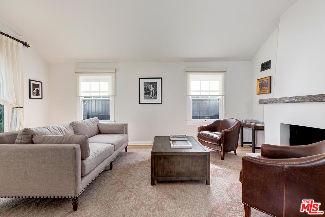 3720 Valleybrink Road Los Angeles, CA 90039 - Photo 6 of 31 a living room with furniture and a fireplace