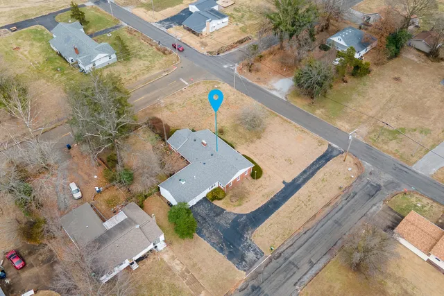 an aerial view of house with yard
