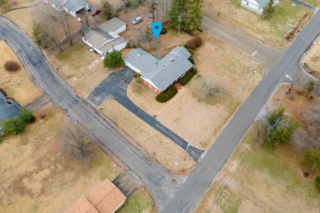 an aerial view of house with a yard