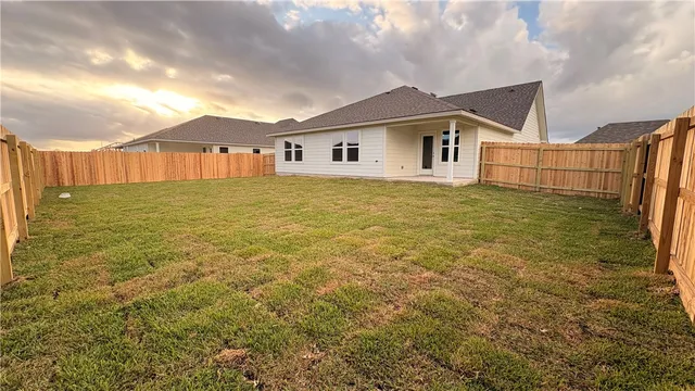 a bathroom with a shower sink and mirror
