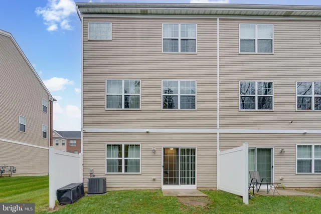 a view of a brick house with a large windows