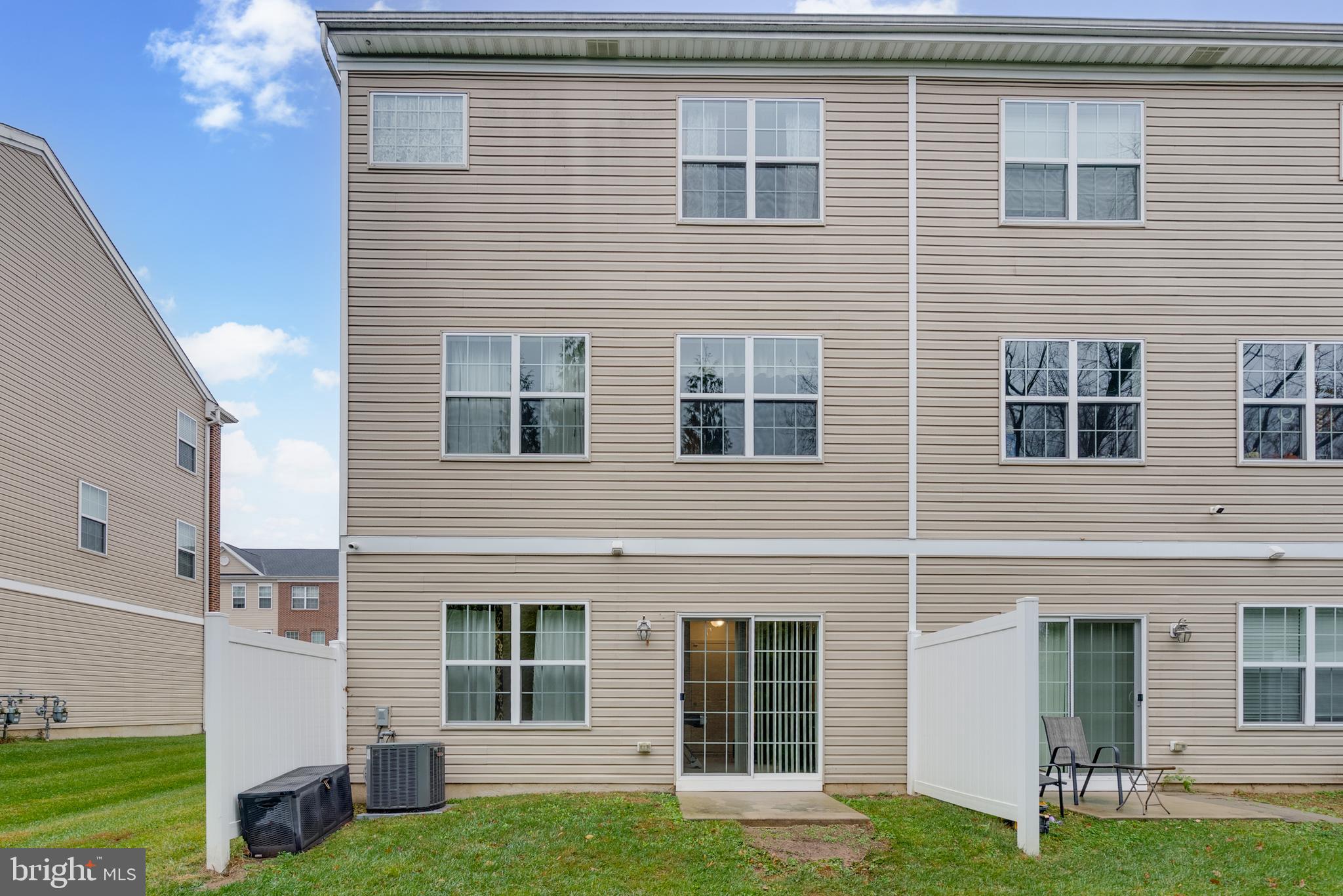 49 Creekside Way Burlington, NJ 08016 - Photo 2 of 25 a view of a brick house with a large windows