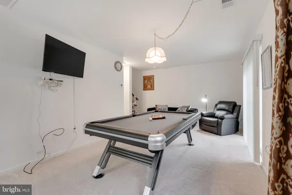 a room with furniture and a flat screen tv